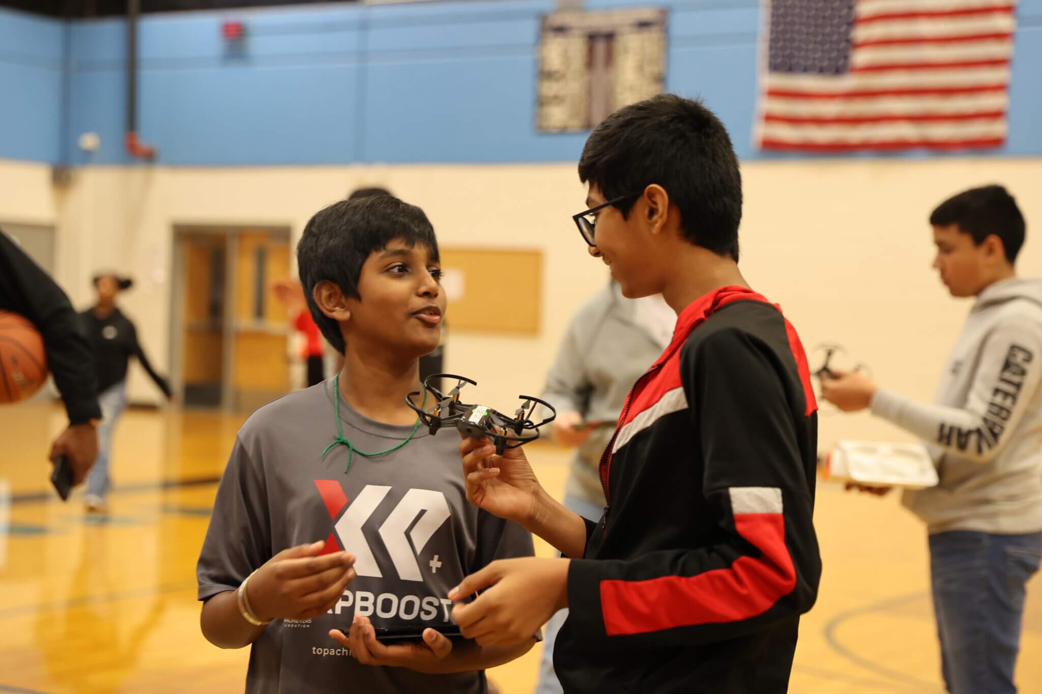 Top Achievers students having engaging conversation at the STEAM Drones Workshop.
