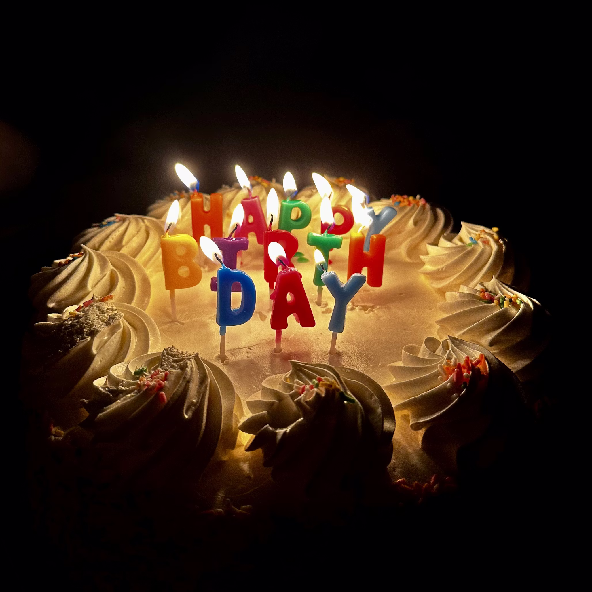 Birthday fundraiser celebration with cake, balloons, and friends supporting a charity event.